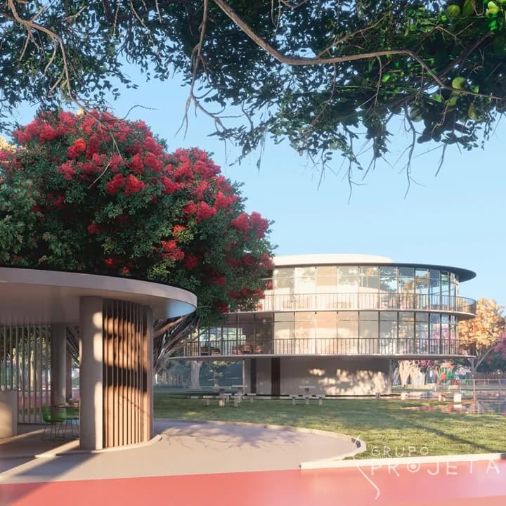 Imagem do projeto do Parque Ilha da Luz, em Cachoeiro do Itapemirim, com edifício curvo sob árvore florida