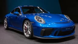 Porsche 911 GT3 Touring azul exposto em salão automotivo