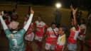 Jogadoras de futebol feminino em campo comemorando