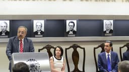 Imagem de arquivo: o ministro Og Fernandes discursa em um púlpito no Salão Nobre do STJ, diante da galeria de retratos de ex-presidentes do tribunal, com autoridades sentadas ao lado