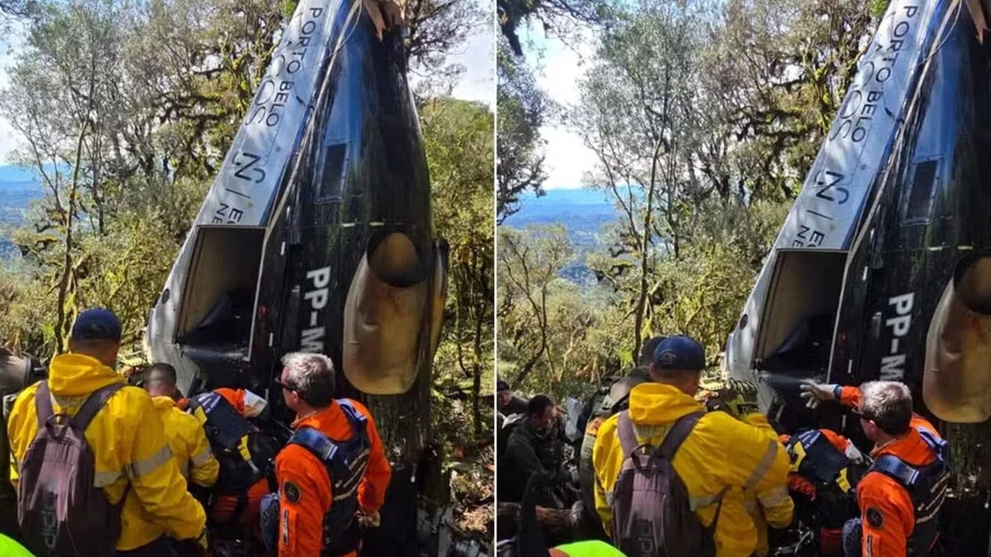 Destroços do helicóptero que caiu na Serra Catarinense, com equipe de resgate no local