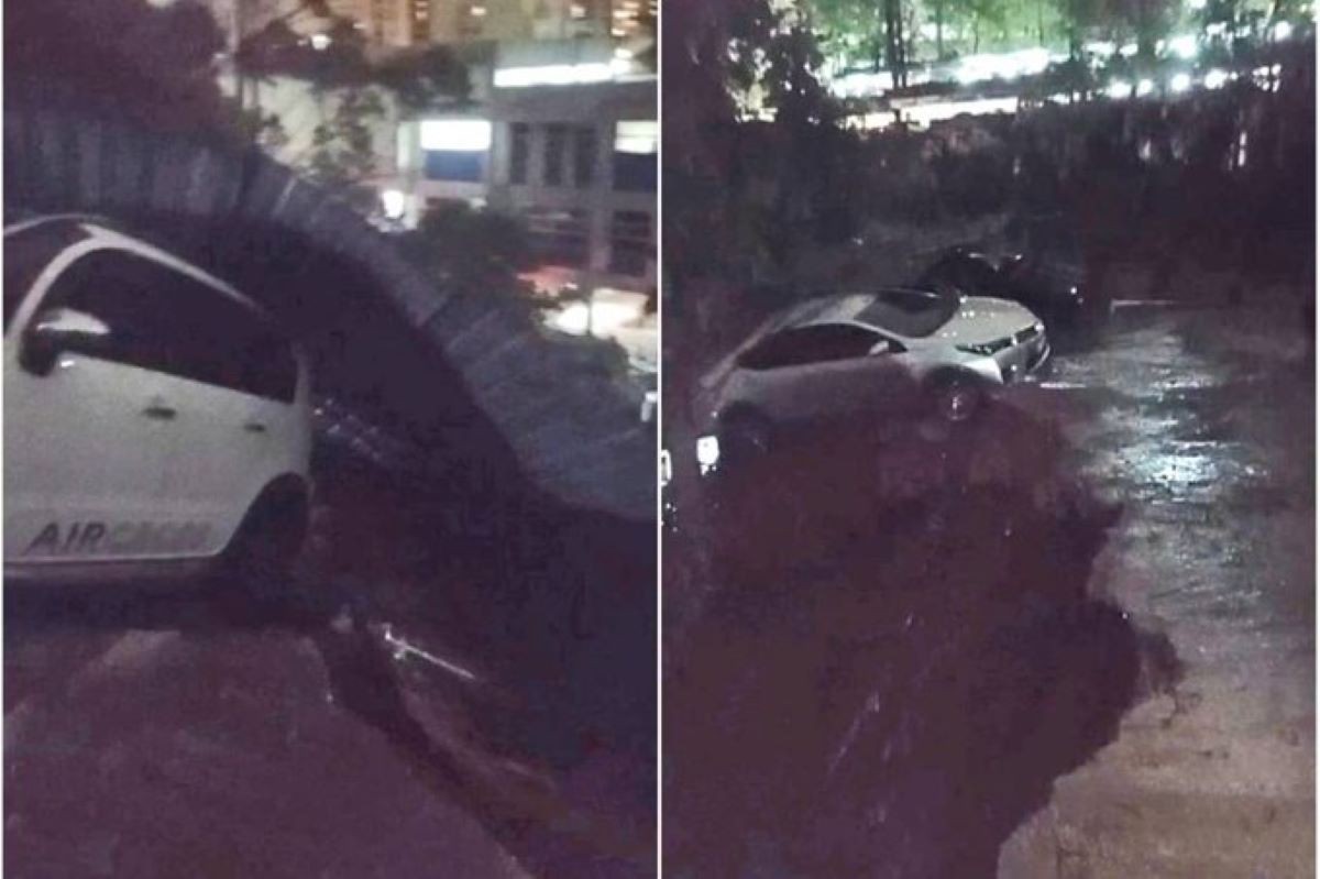 Carro fica pendurado em cratera aberta por forte chuva em São Paulo